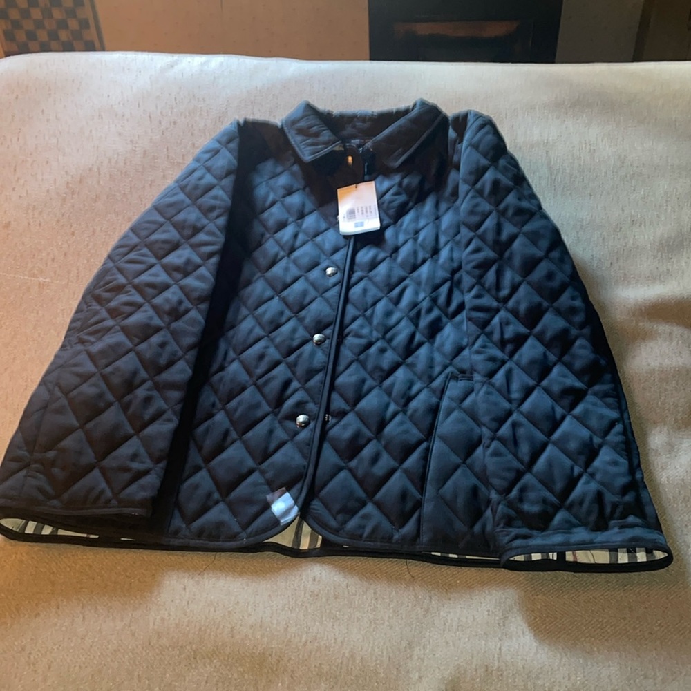 Brand new black Burberry London quilted coat. Size medium.